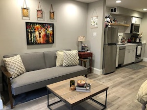 //hemlane-production.s3.amazonaws.com/uploads/property_listing_photos/07ddc4e5-e6f7-4d7c-8403-db07055c6faf/Sofa.webp