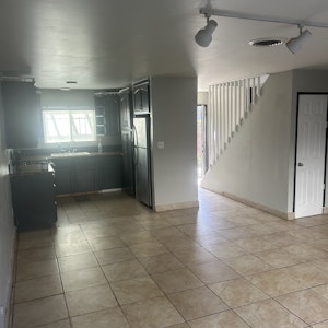 //hemlane-production.s3.amazonaws.com/uploads/property_listing_photos/118fb96f-67d3-4f55-8ea7-40870b7a836c/grandD livingroom:kitchen:frontdoor:storage 12:1:25.jpeg