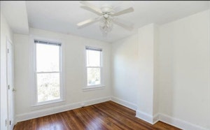 Bedroom has closet, 2 windows and can fit a Queen sized bed and desk comfortably. Wall mounted flat screen television comes with the room.