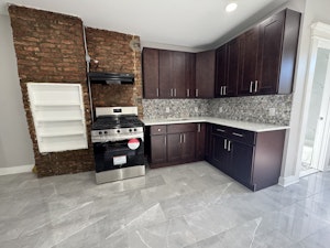 Gut Renovation of Kitchen. All new floors, cabinets, stove, quartz countertop and backsplash