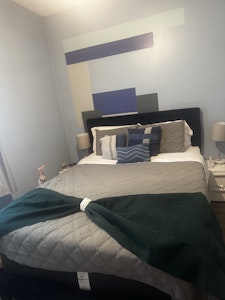 Queen size bed with side stands and lamp
