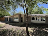 Mid-Century modern curb appeal. Large lot with plenty of shade.