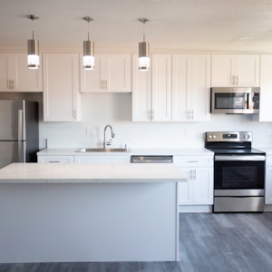 Kitchen with Island and Stainless Steel appliances