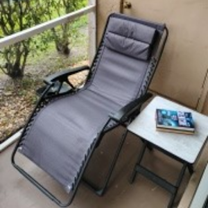Outside deck area with gravity recliner and side table. Spectacular views during day and evening.