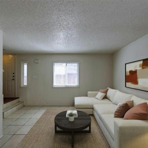 Living room with tile floors and front entry