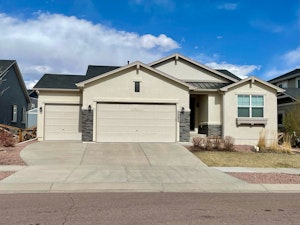 Front showing 3.5 car garage (extra 0.5 adds depth to single bay)