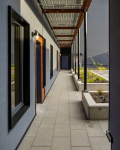 A landscaped courtyard awaits just inside the front gate. Relax, read, or socialize surrounded by vegetation in an urban oasis.