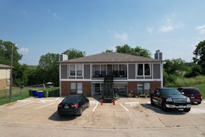 Fourplex Apartment Building with parking in front